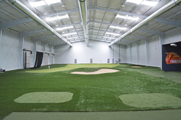 Greenwich indoor putting facility with tee boxes